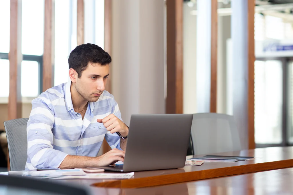 Man researching All American Writer scam claims