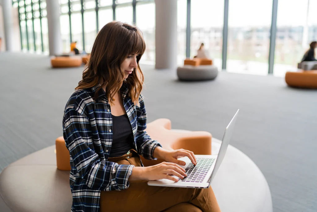 Writer reviewing fraud evidence online
