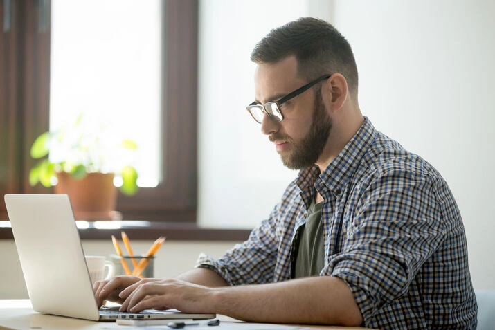 Freelance content writer using laptop